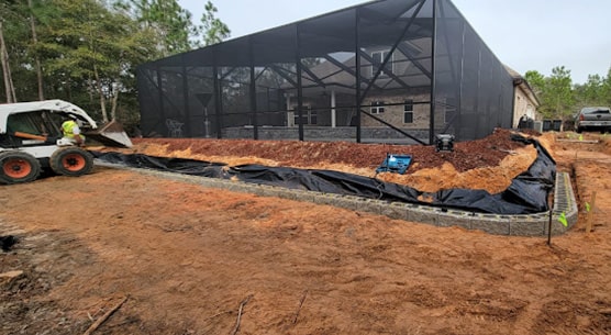 beginning view of pool lanai retaining wall project