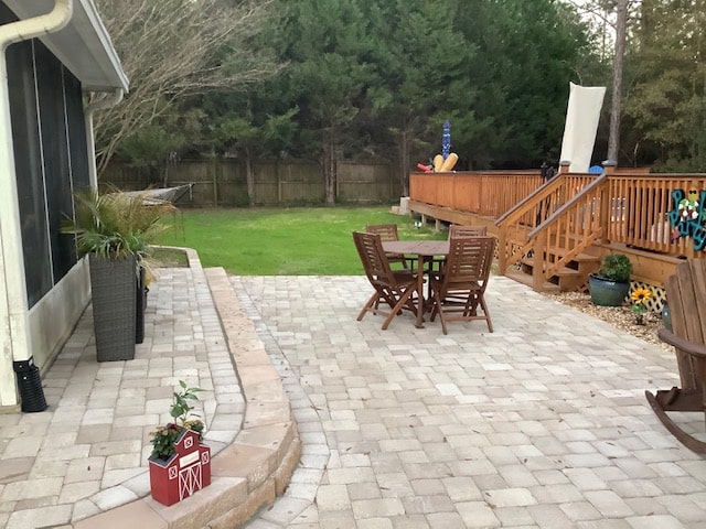 paver patio with table in backyard